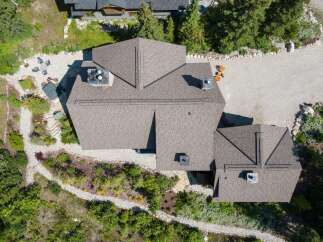 Discover a stunning property with a beautifully designed roof, offering both aesthetic appeal and structural integrity.