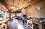 Experience the charm of this cozy chalet, featuring a warm wooden interior and a bright, airy atmosphere.