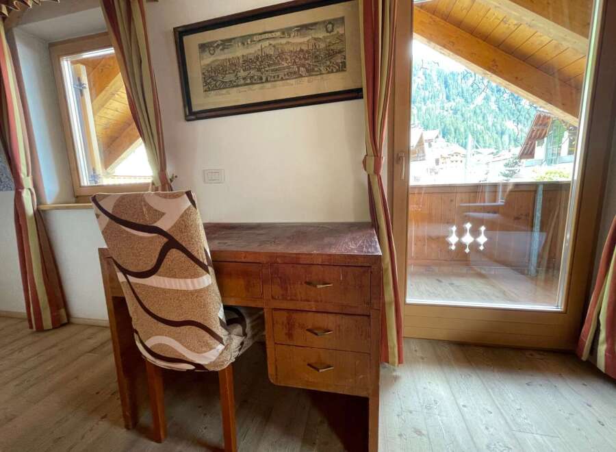 Discover a charming retreat with this cozy desk area, perfect for work or relaxation.