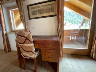 Discover a charming retreat with this cozy desk area, perfect for work or relaxation.