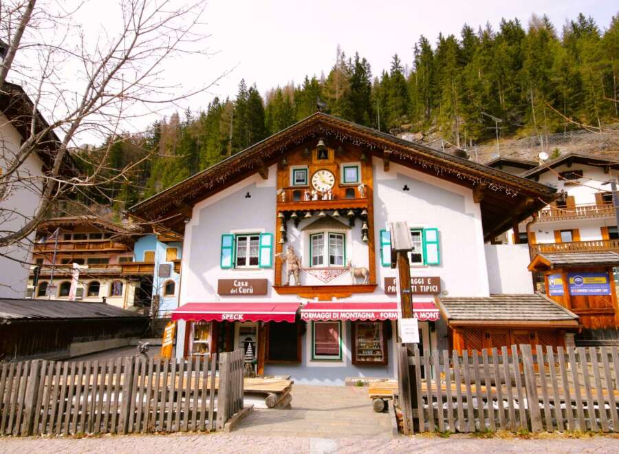 Discover this charming European-style property featuring unique architectural details like a cuckoo clock facade and quaint window shutters.