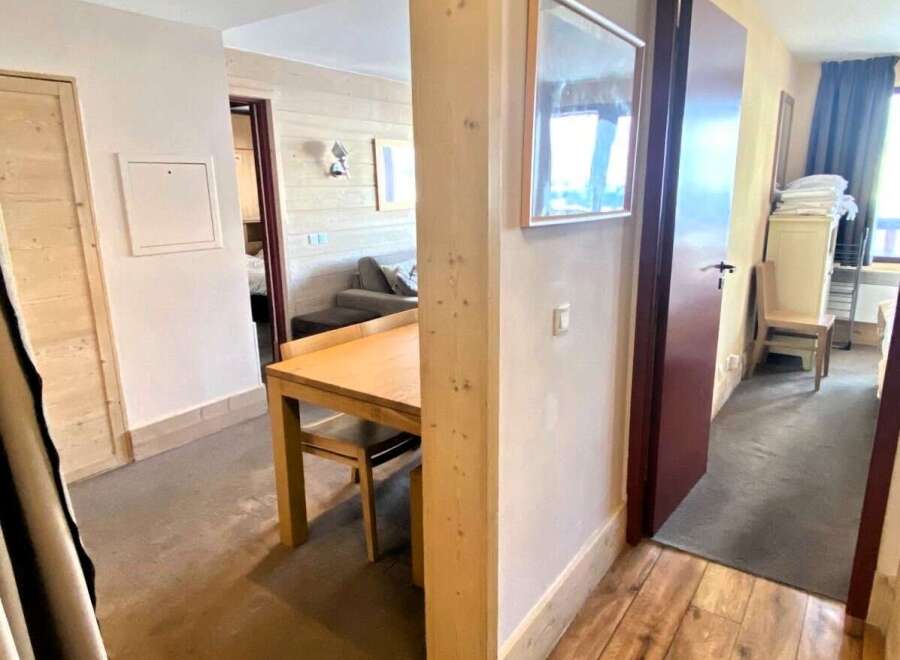 Discover a cozy apartment with a charming dining area, perfect for intimate meals.