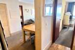 Discover a cozy apartment with a charming dining area, perfect for intimate meals.