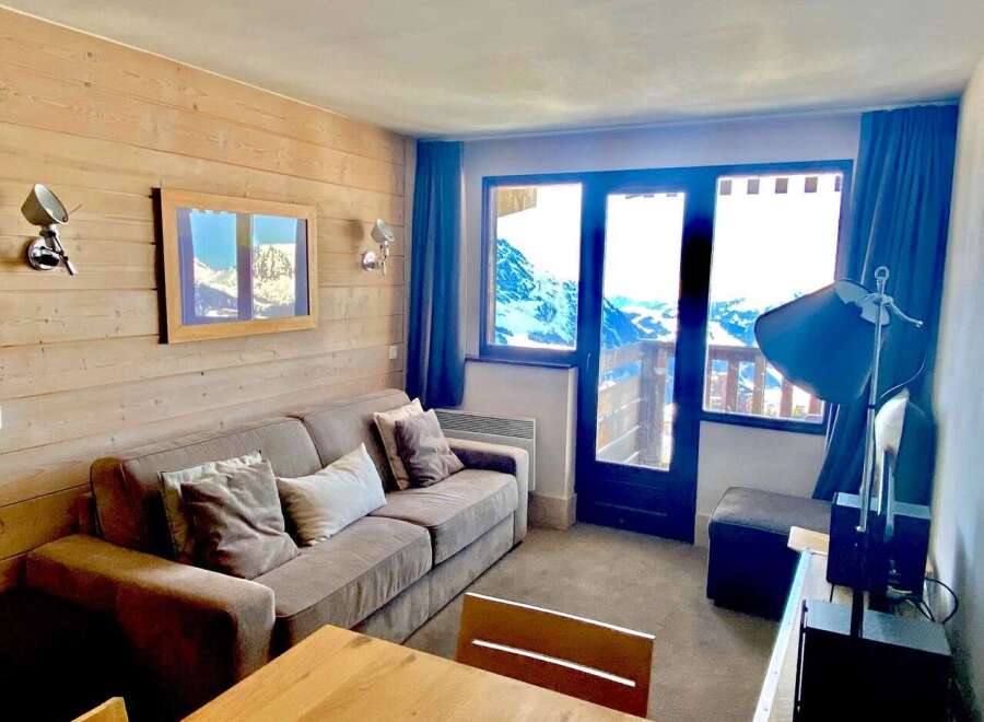 Cozy up in this charming apartment with stunning mountain views.