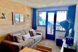 Cozy up in this charming apartment with stunning mountain views.