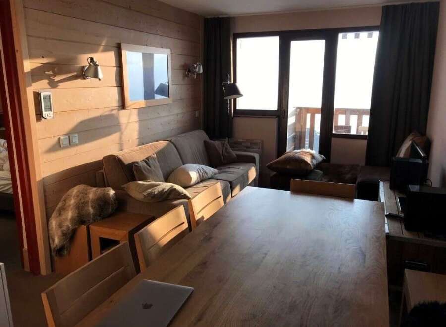 Cozy living space with a rustic wooden aesthetic.