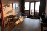 Cozy living space with a rustic wooden aesthetic.