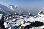 Experience the ultimate winter getaway in this stunning snow-covered village nestled in the mountains.