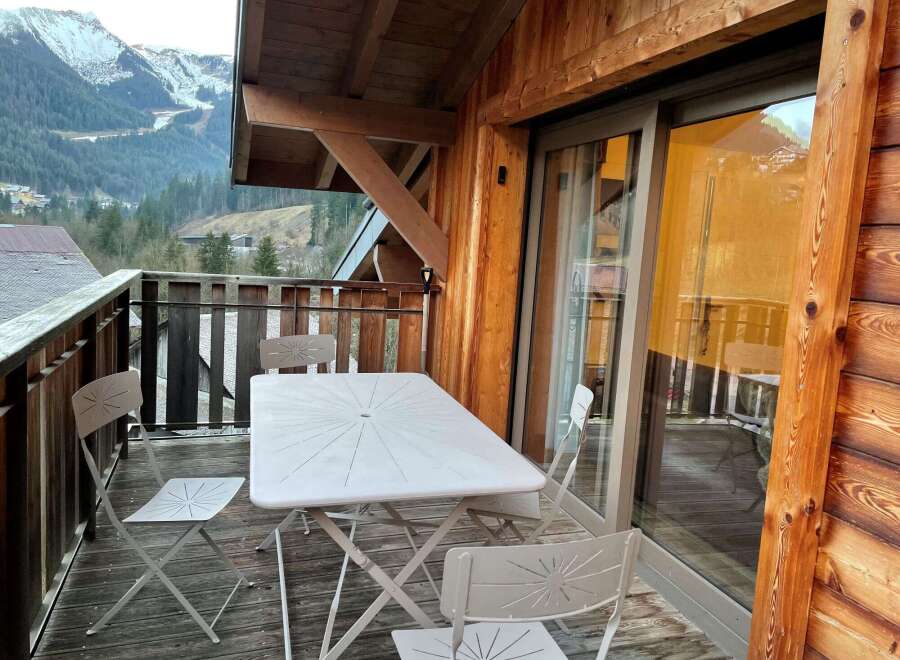 Enjoy breathtaking mountain views from this charming balcony.