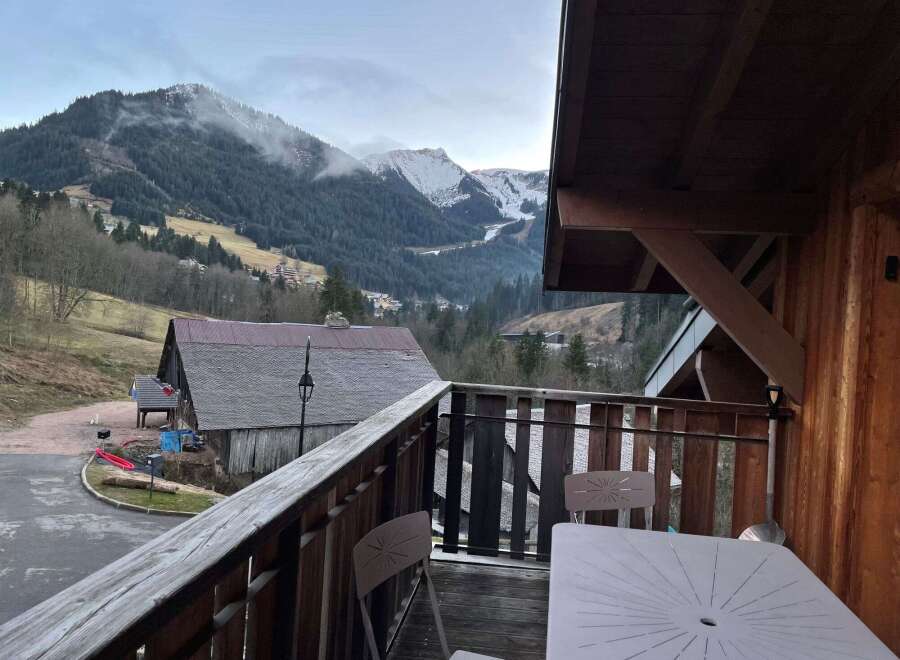 Enjoy breathtaking mountain views from this charming balcony.