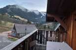 Enjoy breathtaking mountain views from this charming balcony.
