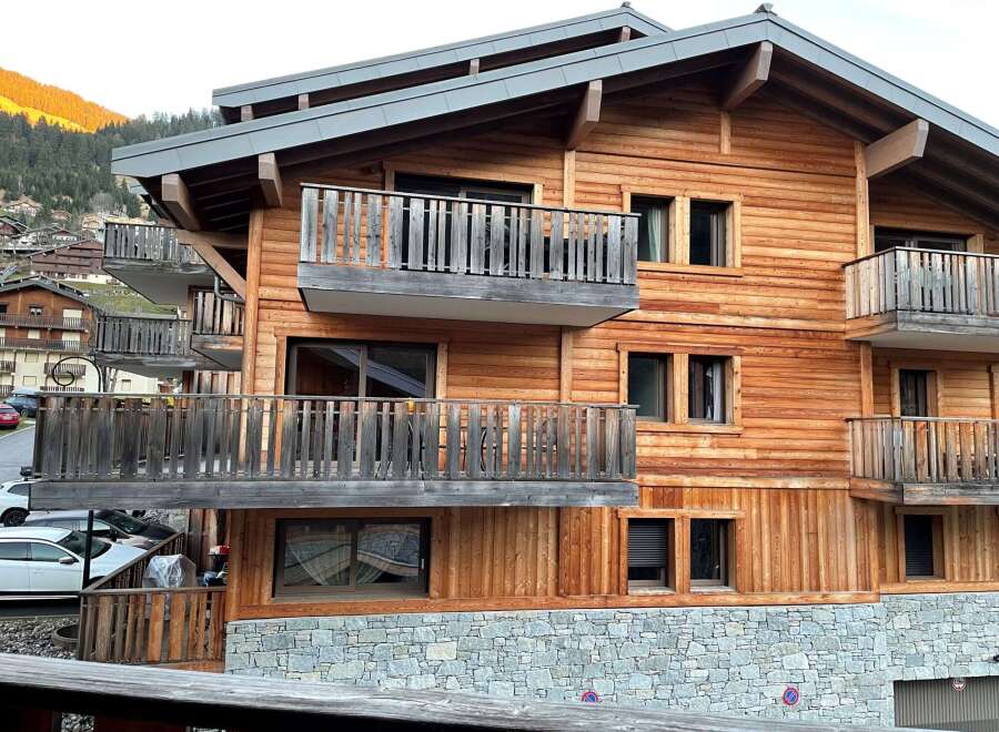 Discover the charm of this stunning wooden chalet, boasting a beautiful stone base and multiple balconies.