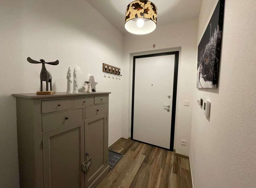 Step into a stylish entryway with a touch of rustic charm.