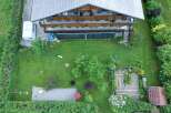 Discover this charming property featuring a spacious house with a beautiful wooden balcony.