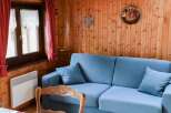 Cozy living space with a charming wooden interior.