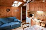 Cozy cabin retreat with charming wooden interiors.