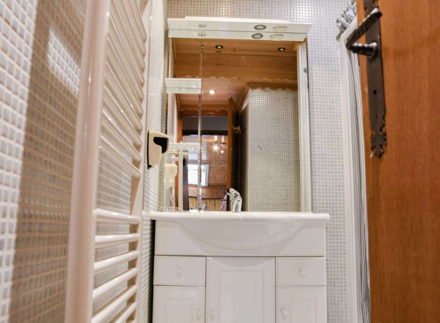 Step into a charming bathroom with a touch of rustic elegance.