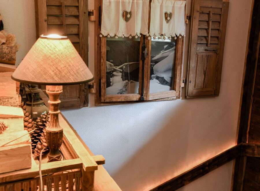 Cozy cabin vibes abound in this charming space.