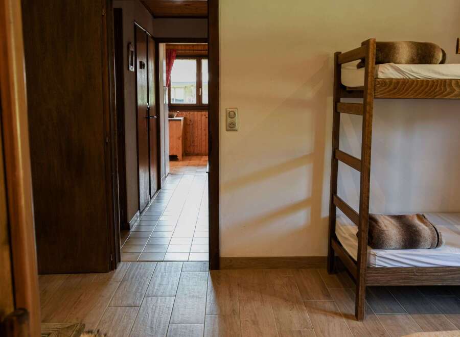 Cozy bedroom with a bunk bed, perfect for a family getaway.