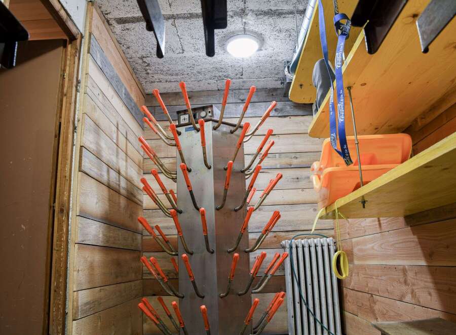 This cozy space features a unique boot drying rack, perfect for storing and drying ski boots.