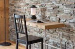 This cozy space features a stylish desk with a natural wood finish, perfect for work or leisure.