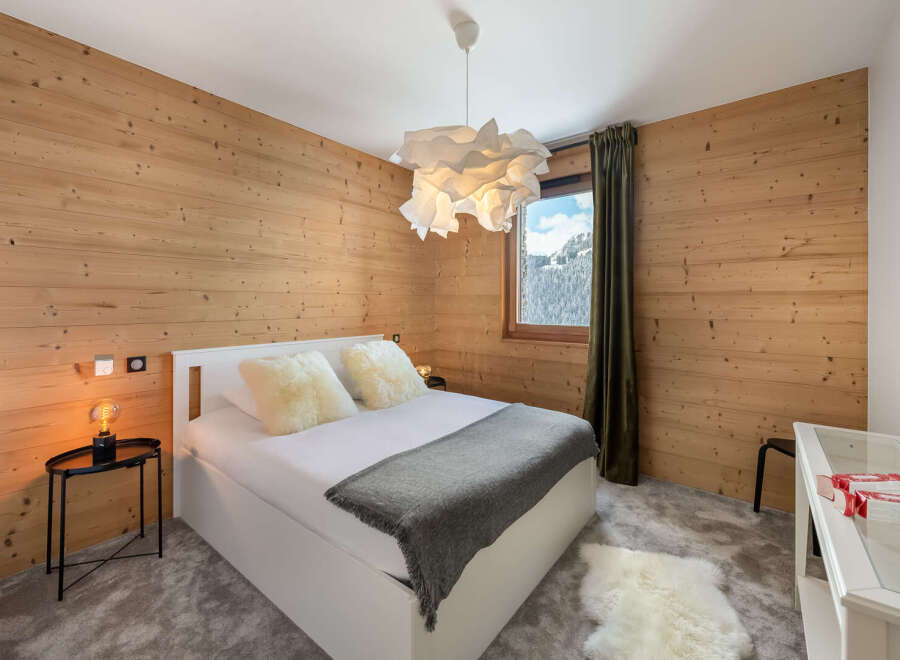 Experience the ultimate in cozy comfort in this stunning bedroom.