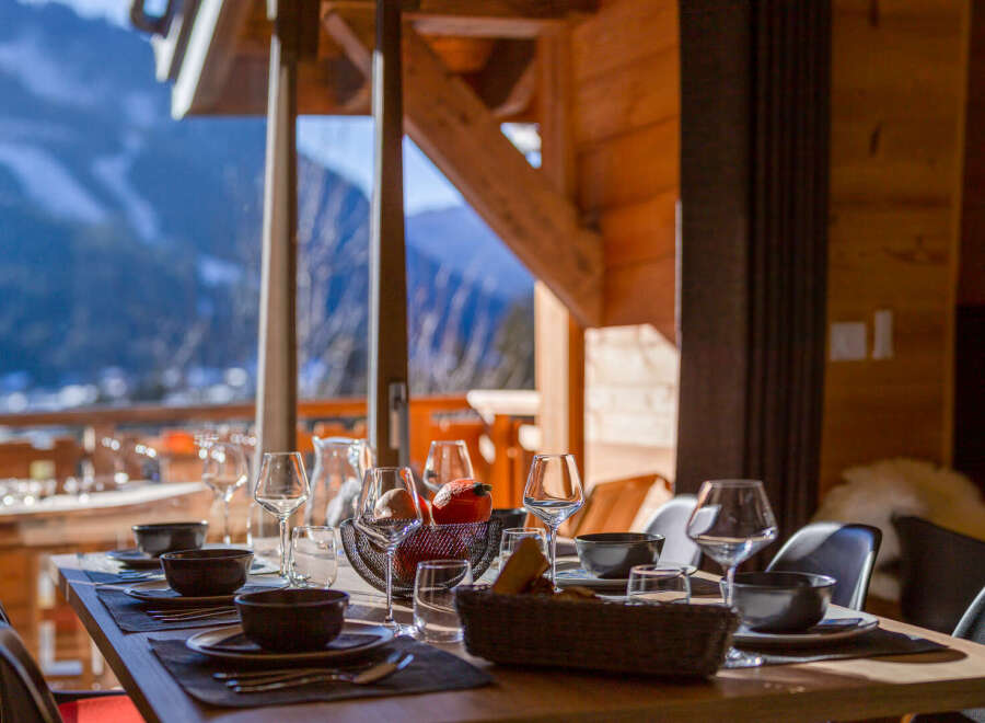 Enjoy breathtaking mountain views from this cozy dining area.