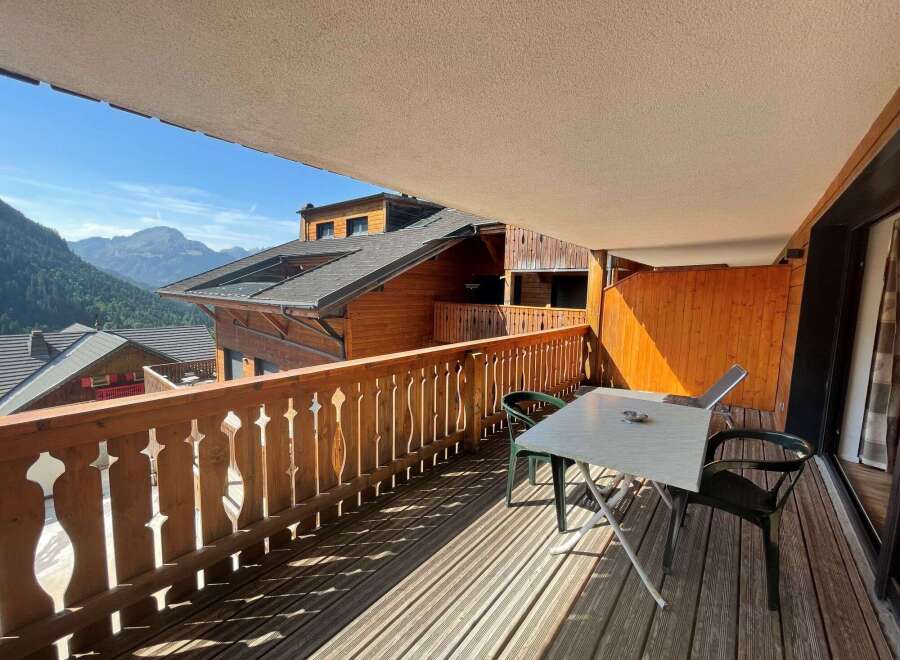 Enjoy breathtaking mountain views from this charming balcony.