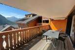 Enjoy breathtaking mountain views from this charming balcony.
