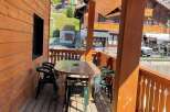 Enjoy the charm of this wooden balcony, perfect for relaxing and taking in the views.