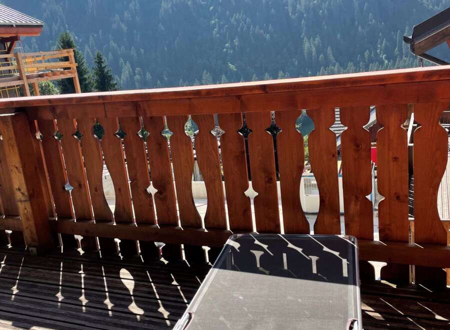 Enjoy breathtaking mountain views from this charming balcony.