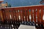 Enjoy breathtaking mountain views from this charming balcony.