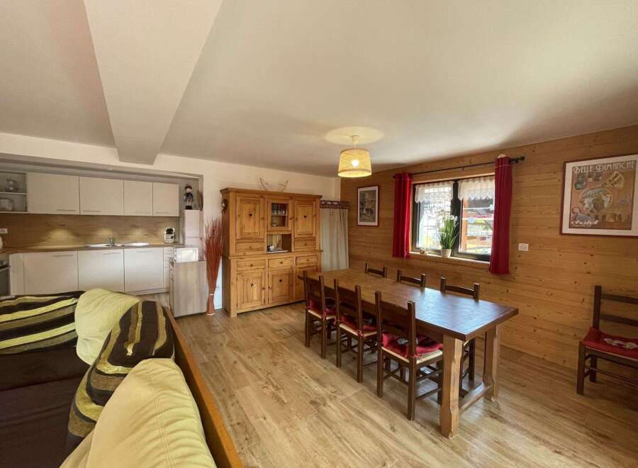 This charming property boasts a warm and inviting dining area, perfect for gatherings.