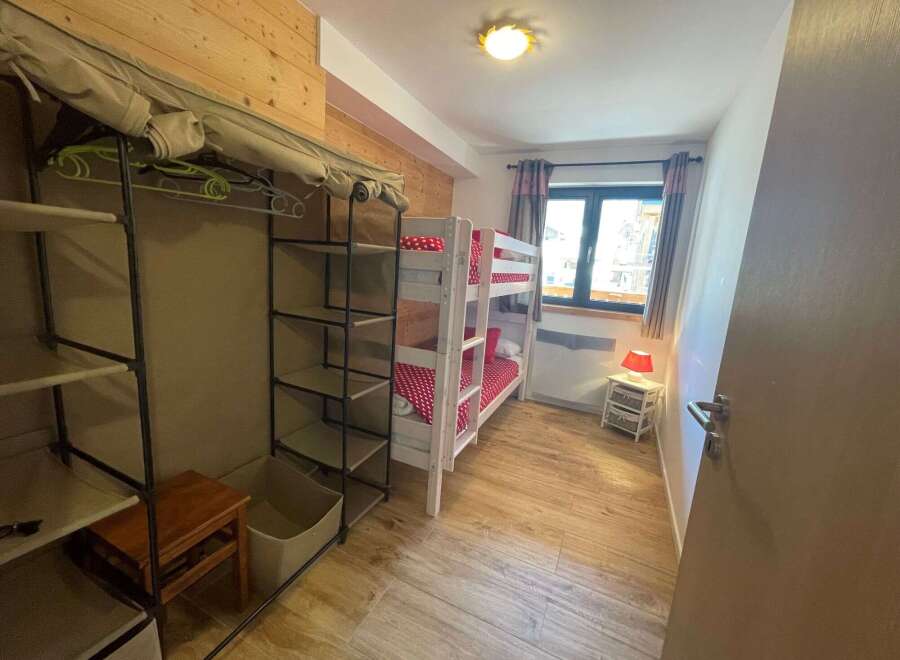 Cozy bedroom with bunk beds, perfect for families or groups.