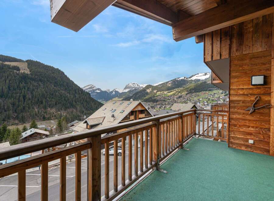 Enjoy breathtaking mountain views from this charming balcony.