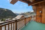 Enjoy breathtaking mountain views from this charming balcony.