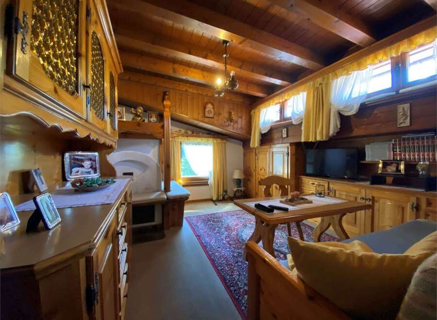 Step into a cozy retreat with this charming property, featuring warm wooden interiors and a rustic ambiance.