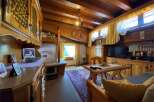 Step into a cozy retreat with this charming property, featuring warm wooden interiors and a rustic ambiance.