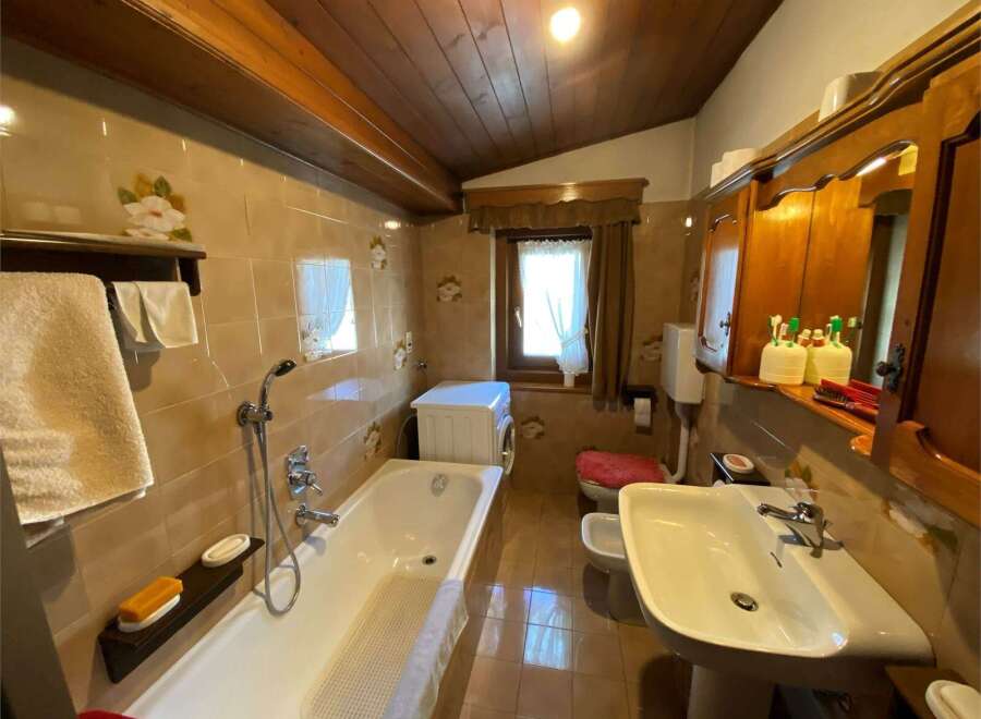 This charming bathroom features a classic design with warm, inviting tones.