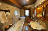 This charming bathroom features a classic design with warm, inviting tones.