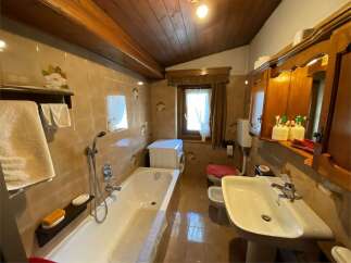 This charming bathroom features a classic design with warm, inviting tones.