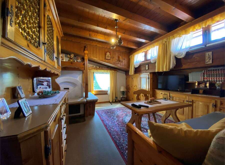 Step into a cozy retreat with this charming property, featuring warm wooden interiors and a rustic ambiance.