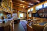 Step into a cozy retreat with this charming property, featuring warm wooden interiors and a rustic ambiance.