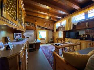 Step into a cozy retreat with this charming property, featuring warm wooden interiors and a rustic ambiance.