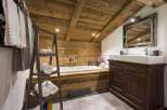 Experience rustic charm in this cozy bathroom.