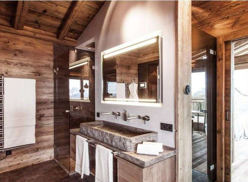 Experience rustic luxury in this stunning bathroom.