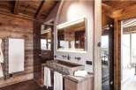 Experience rustic luxury in this stunning bathroom.