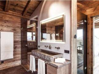 Experience rustic luxury in this stunning bathroom.