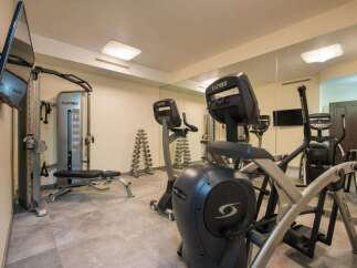This well-equipped gym offers a variety of Cybex machines for a comprehensive workout.