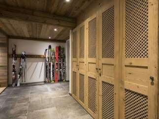 This stunning property boasts a ski storage room, perfect for winter enthusiasts.